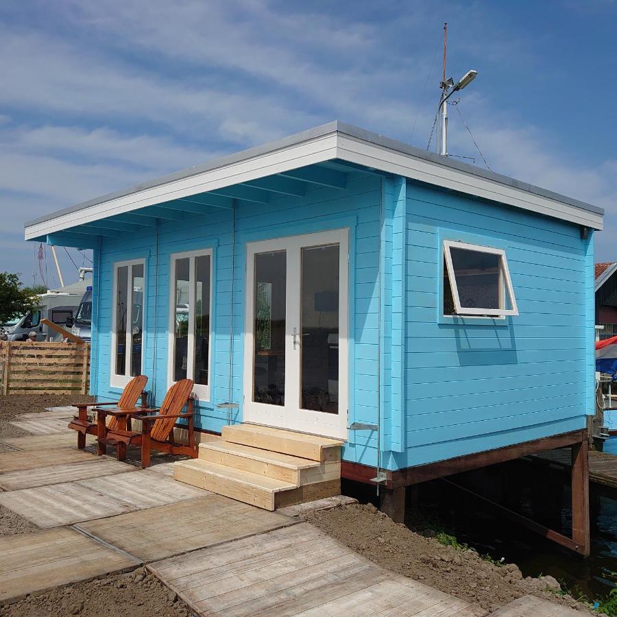 Waterhuisjes Op De Pier Van Lauwersmeerplezier! ラウエルウオーフ エクステリア 写真